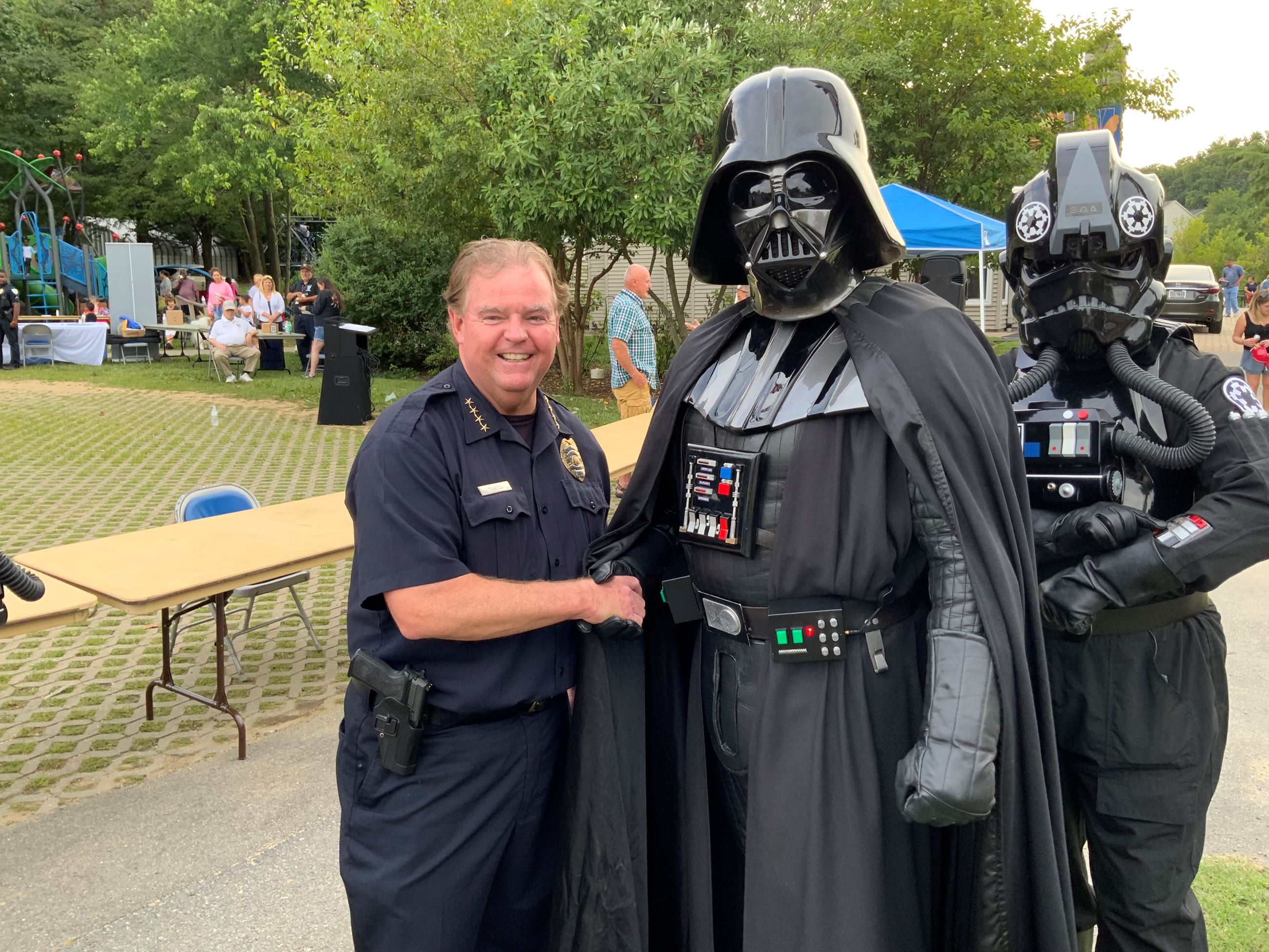 Laurel Police Chief Russ Hamill posing next to Darth Vader