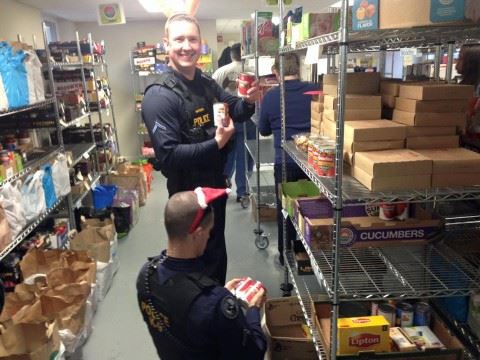 Police Next to Boxes of Food